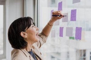 Woman doing a Retirement Planning with paper tags.