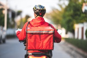 Men working in a motocycle, as a gig economy.