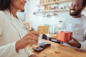 Woman enjoying the Benefits of Using a Credit Card.