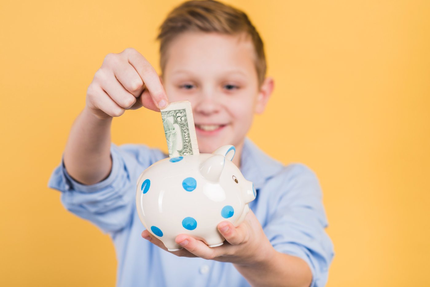 children saving money with the help of Savings Accounts for Kids.