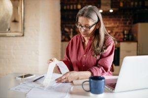 Woman organizing bad money habits.