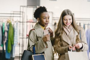 Women doing shopping and enjoying the credit card cashback rewards.
