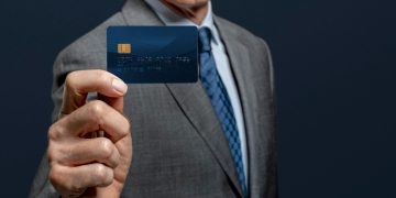 A man holding his United Explorer Card