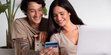 happy couple shopping using buy now pay later system