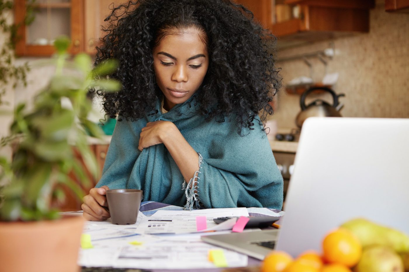 woman calculating her finances to be independent