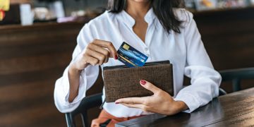 Woman learning how to Maximize Credit Card Rewards.